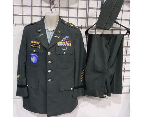 American Vietnam War period officers dress uniform, badged for US First Cavalry (Airborne) Division, displaying ribbon bars, 