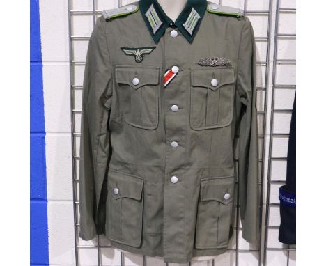 A German WWII reenactors NCOs tunic, displaying close combat clasp and embroidered breast eagle. UK P&amp;P Group 2 (£20+VAT 