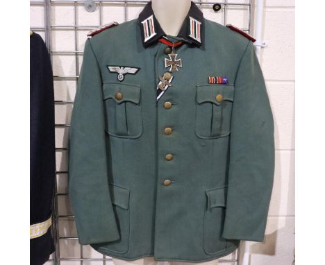 A German WWII reenactors officers tunic, displaying ribbon bar, Knights Cross, Iron Cross spange, with wired bullion epaulett