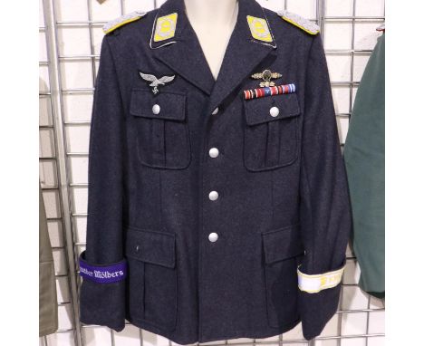 A German WWII reenactors Luftwaffe officers tunic, displaying ribbon bar, embroidered cuff title, observers award and wired b