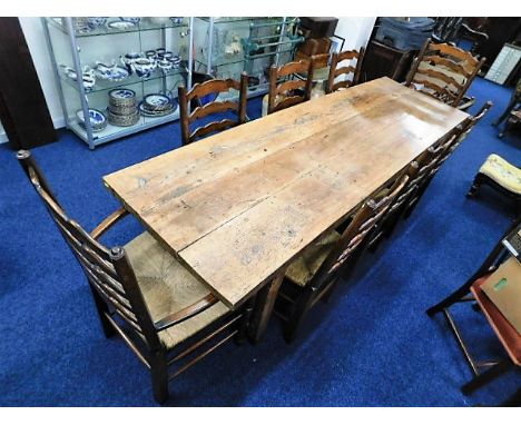 An impressive 18thC. elm farmhouse refectory table, 8ft 2in long x 30in wide set with six rush seated oak Lancashire style la