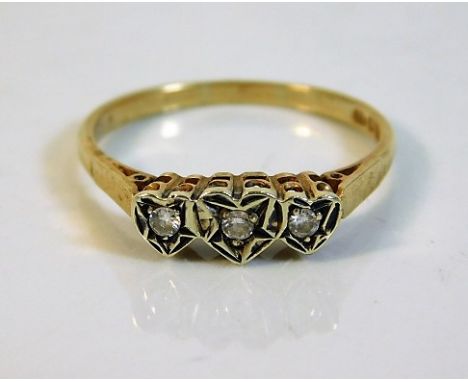 A 9ct gold ring set with three white stones in heart shaped setting 2.1g size R