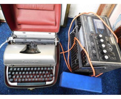 A Remington typewriter twinned with a Coomber tape deck &amp; radio