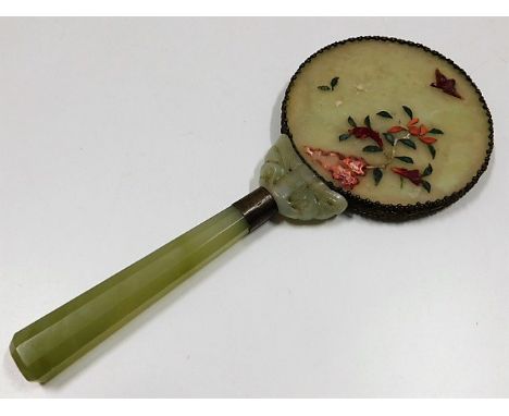 A c.1900 Chinese jade mirror with moth type decor at top of handle, some losses to decor on rear 10.75in long