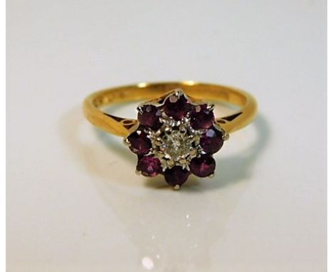 An 18ct gold ring set with ruby &amp; diamond 3g size K 