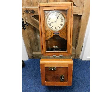 An oak cased British Time Recorder Co. Ltd workclock 39in tall with pendulum