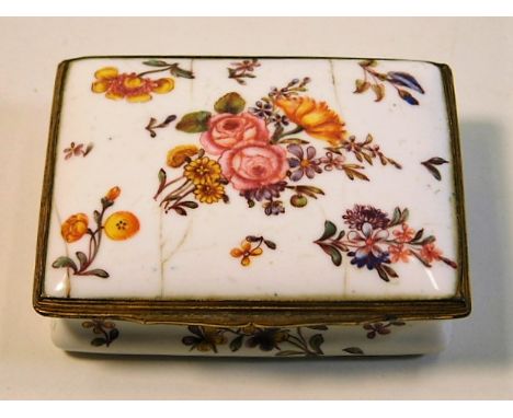 An antique enamel patch box with floral décor 2.625in wide