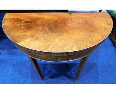 A Georgian mahogany folding card table with ebony &amp; satinwood inlay to edge 37in diameter. Provenance: Originally from Tr