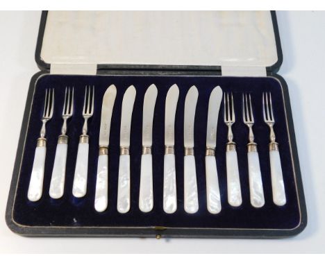 A 1918 James Dixon &amp; Son cased silver dessert knife &amp; fork set with mother of pearl handles 