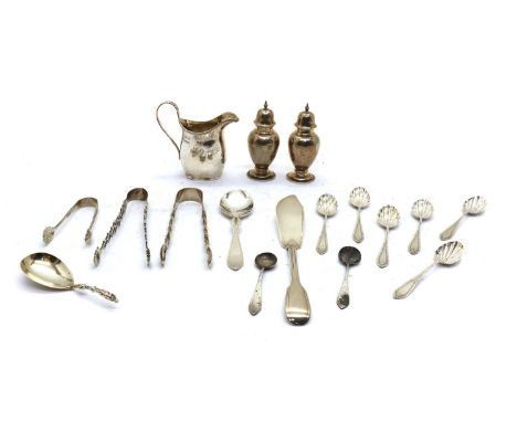A collection of silver flatware,to include a pair of sugar tongs with pierced handles, possibly by chawner or William Chatter