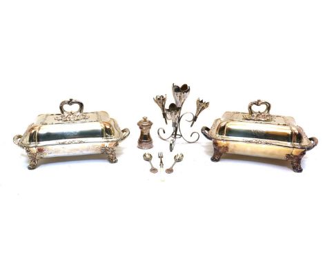 A pair of silver plated entree dishes,twin handled with pull off cover,37cm wide 20cm deep18cm high together with a silver pl