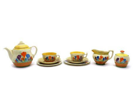 A Clarice Cliff 'Autumn Crocus' tea service,1930s, comprising; a large Windsor teapot, 16cm high, a faceted cream jug, 9cm hi