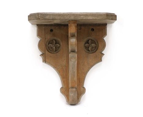 A large oak wall bracket, 19th century, with carved flowerhead roundels, 50cm wide38cm deep53cm highCondition ReportSome disc