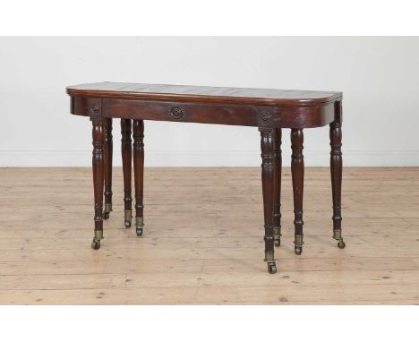 A mahogany extending dining table,19th century, with two extra leaves, concertina action, stamped 'Wilkinson', the 'D' shaped