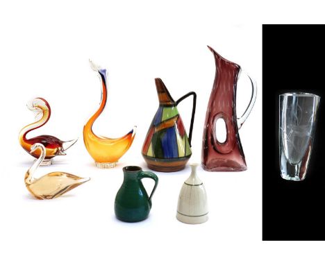 A group of three coloured glass birds,1960s, 28cm, 18cm and 12cm high;together with a Stromberg clear glass vase, with a fish