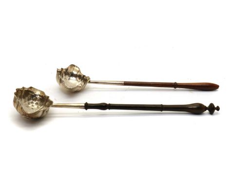 A George II silver toddy ladle,makers mark EM, London 1759, with a floral embossed bowl, 30cm longtogether with a George III 