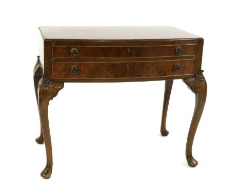 A silver plated canteen for twelve settings, by Walker &amp; Hall, 'St James' pattern, the walnut canteen with cabriole legs 