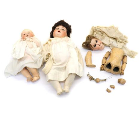 An Armand Marseilles doll,of a baby, wearing a dress and cardigan, with glass eyes, 41cm hightogether with another Armand Mar
