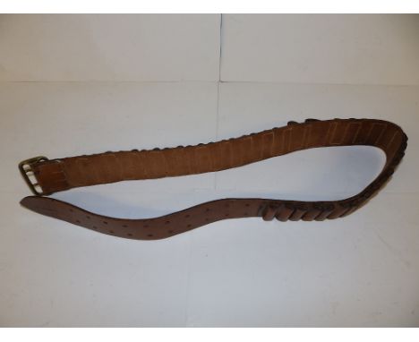 A leather ammunition bandilier with maker's mark &amp; dated 1917.