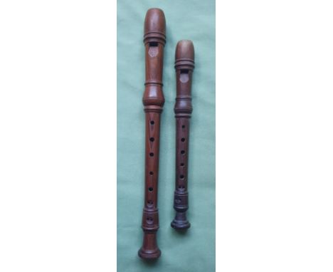 Two vintage Dolmetsch recorders, the larger, 12", numbered 26140, the smaller, 26405.