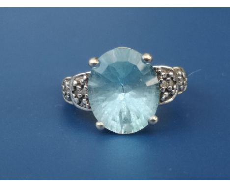 A blue topaz &amp; diamond set 9ct white gold ring.  Finger size J.