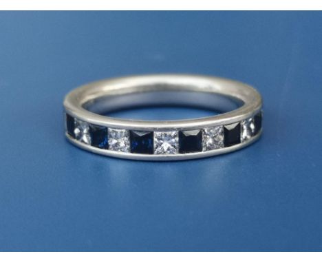 A sapphire &amp; diamond calibre set platinum half eternity ring.  Finger size M.