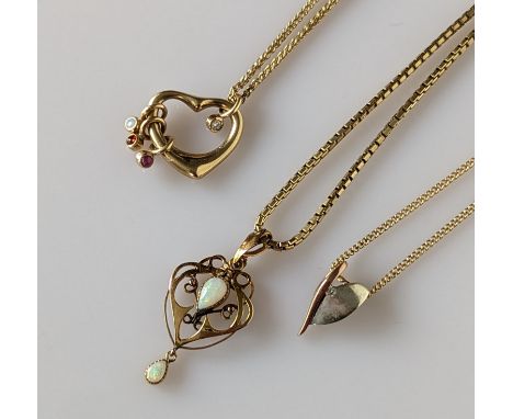 An Art Nouveau yellow gold and opal carved pendant chain, 40mm, chain 53 cm and two other pendant chains, all hallmarked 9ct,