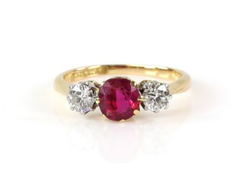 Three stone ring set with two diamonds and a synthetic ruby, diamond weight estimated at 0.50 carat, 18 ct gold and platinum 