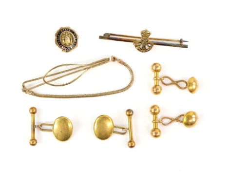 A pair of gold oval panel cufflinks, with chain link and t-bar fittings, stamped 22 ct, with another similar round pair, stam