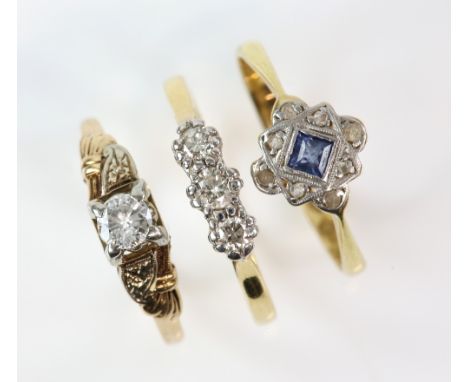 Three rings, diamond three stone, ring size M, another sapphire and diamond ring, size N, both mounted in 18 ct, diamond sing