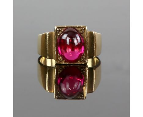 Gold ring set synthetic ruby cabochon mount testing as 14 ct, C 1970, ring size T.     CONDITION14 ct gross weight 11.4 grams