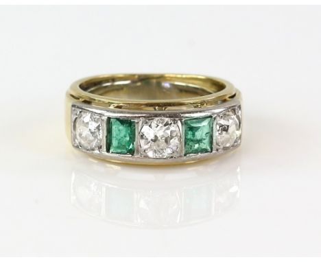 Emerald and diamond ring, three old cut diamonds and two square cut emeralds in gold channel setting, total diamond  diamond 