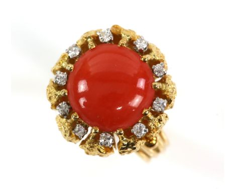 1970's ring by Hans Georg Mautner, centrally set with round cabochon coral, 11mm in diameter, set within a border of Swiss cu