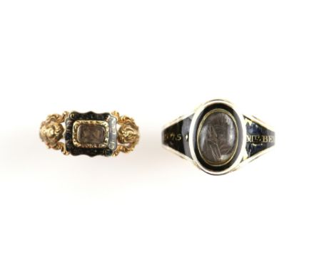 Two antique mourning rings, a Georgian ring with central oval glazed hairwork panel, black and white enamel border, outside o