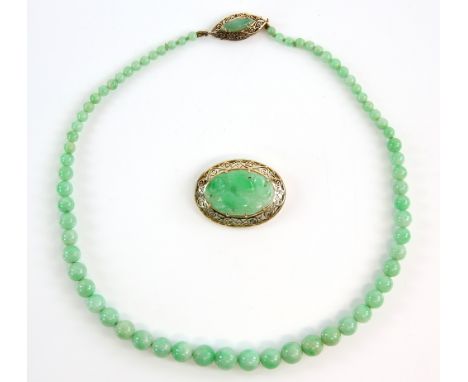 A Vintage jadeite jade graduated necklace to a marquise form gold clasp, testing as 14 ct, length 42 cm and a brooch with car