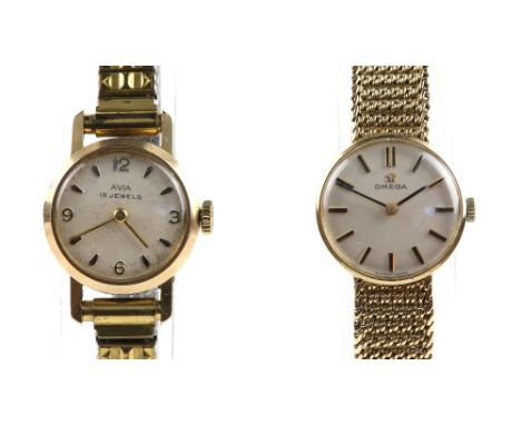Omega Ladies gold dress watch the circular white dial signed and fitted with baton hour markers and gilt hands, fitted with a