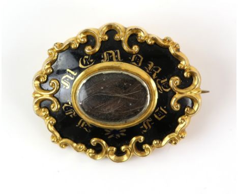 Victorian gold mourning brooch,' In Memory of ' in gilt lettering on black enamel, central hairwork panel and scroll border, 