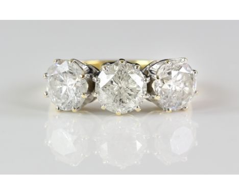 Diamond ring, set with three round brilliant cut diamonds, estimated total diamond weight 3.66 carats, mounted in 18 ct yello