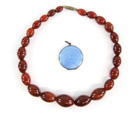 Amended Description - 1920's graduated agate bead necklace, 39.5cm in length and a blue enamel locket, 3cm in diameter.     C