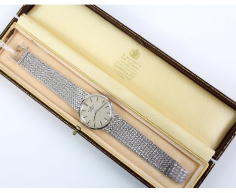Universal Geneve ,A Gentleman's white gold dress watch,the signed white dial with applied white gold  baton hour markers, fit