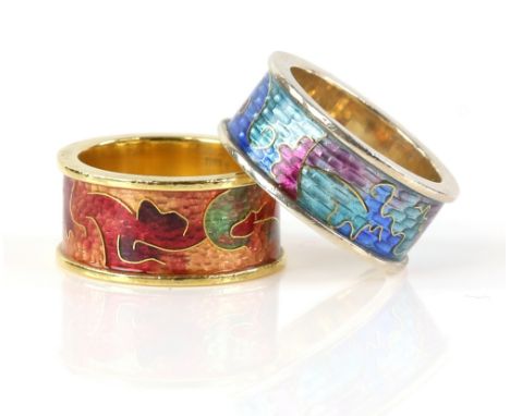 Two enamel rings, one with an abstract enamel motif in orange, yellows and greens, mounted in 18 ct  yellow gold, and the oth