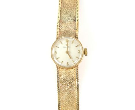 Omega, a Ladies Reference 1061 gold wristwatch, the signed silvered dial  with baton hour markers , fitted with a calibre 484