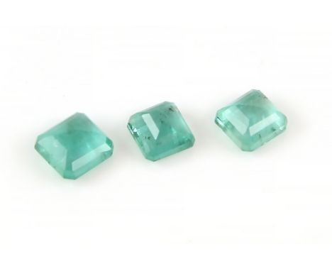 Three loose rectangular step cut emeralds, estimated weights 2.24 carats, 2.11 carats and 1.87 carats.     CONDITION