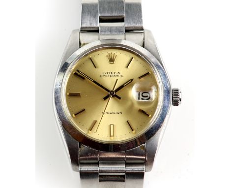 Rolex  A gentleman's reference 6694  Oyster perpetual stainless steel wrist watch, the signed  champagne dial with baton hour