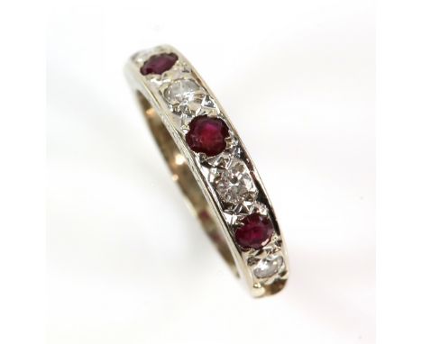 Mid 20th C ruby and diamond half eternity ring, white gold mount stamped 18 ct, ring size K 1/2 and a pair of diamond studs, 