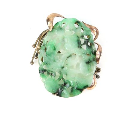 Jade brooch, carved and pierced oval plaque depicting a bird in branches, pin and roll catch fitting, mount testing as 9 ct. 