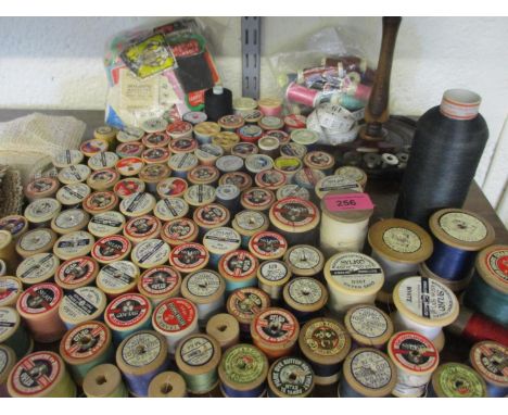 A quantity of cotton reels to include early Chadwicks, Coates, Sylko and Dewhurst wooden examples, together with vintage cott