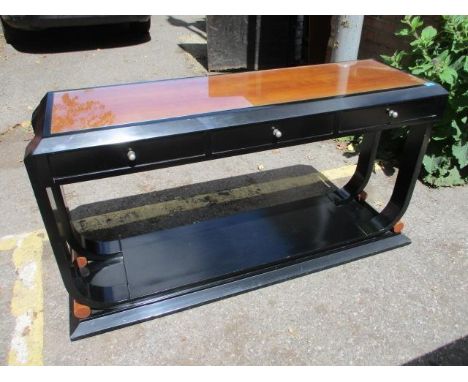 A Chinese style black lacquered console table with three small drawers 