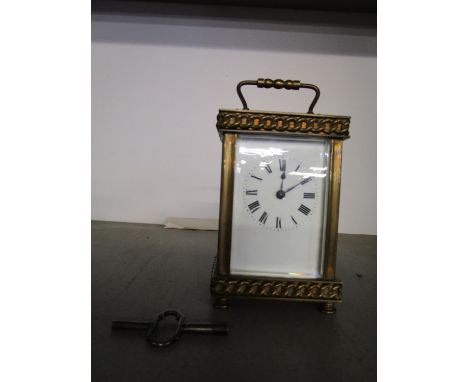 A French brass cased five window carriage clock, with key 