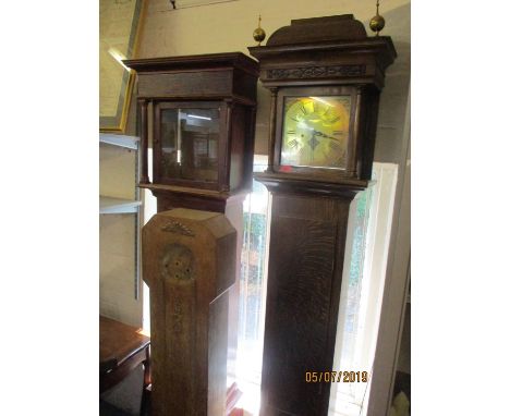 A Georgian oak cased 8 day longcase clock having a gilt dial with applied spandrels and Roman numerals 